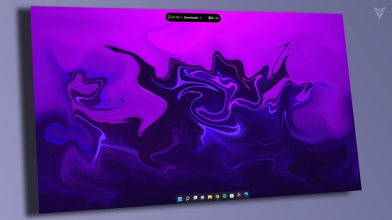 Windows desktop with a compact media island at the top